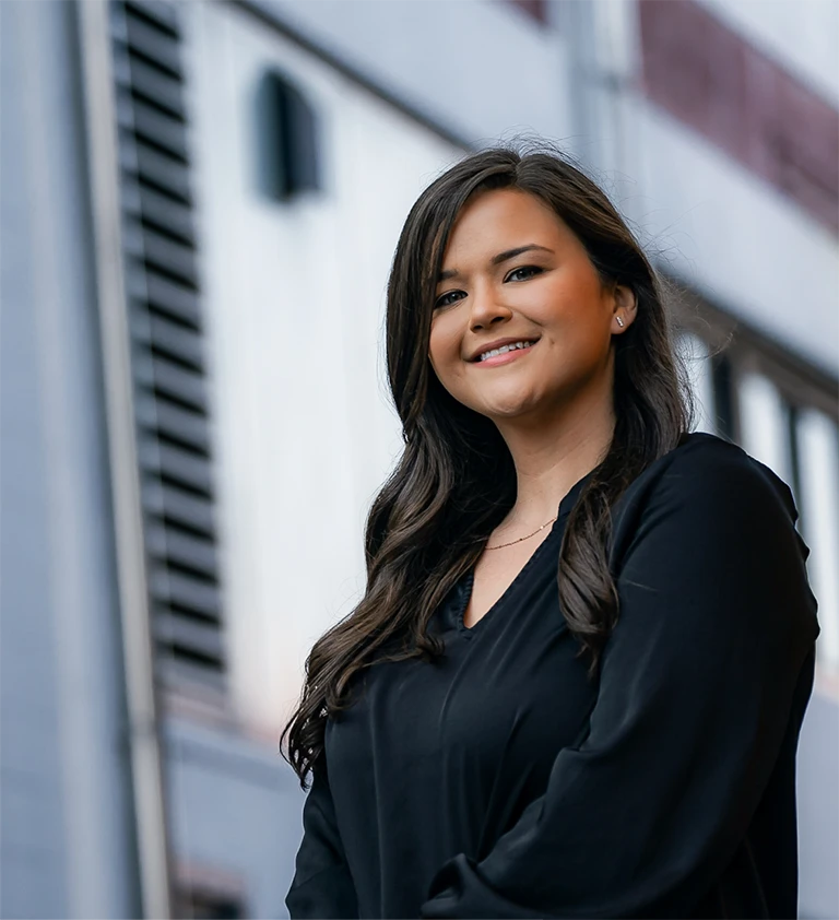 Woman manager smiling out of Swisher’s office.